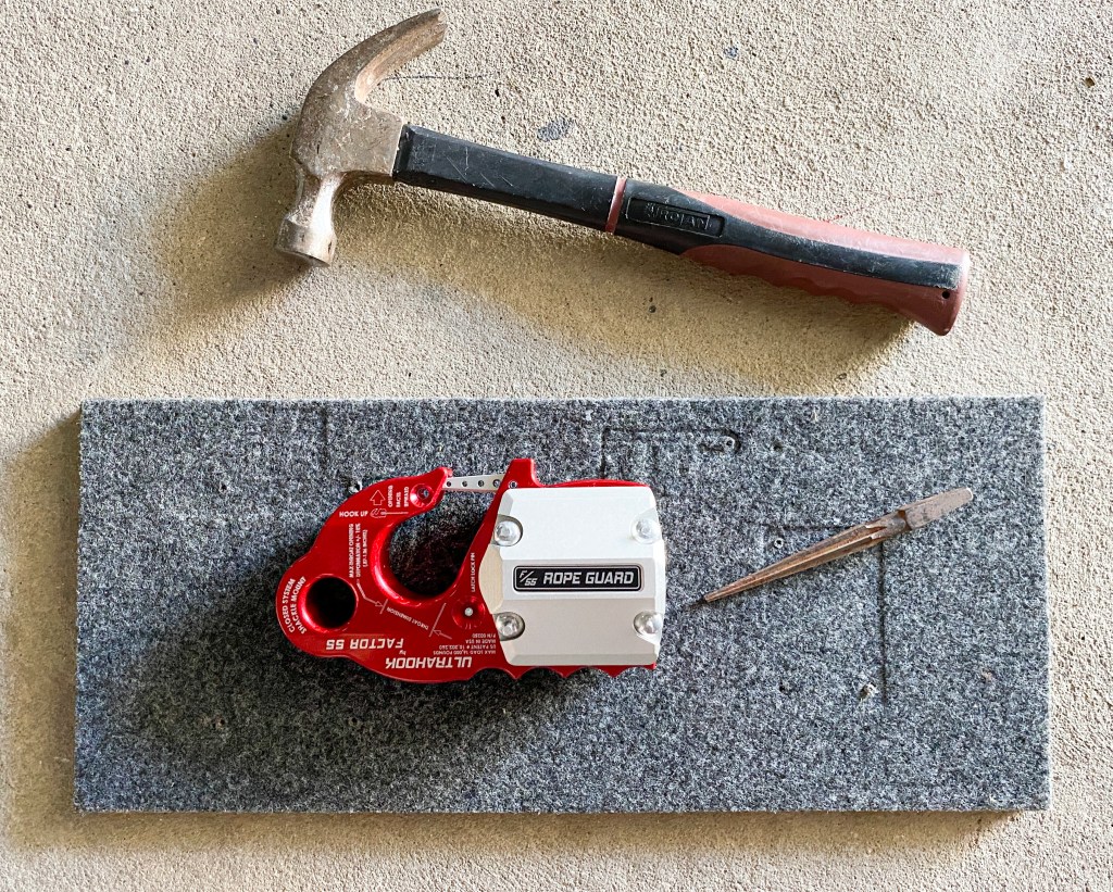 It's better to rest the hook on some wood when hammering in the drive nuts so you don't damage the anodised coating